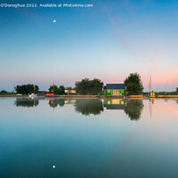 Buy canvas prints of Reflections of huts on the Norfolk Broads at Horsey by Richard O'Donoghue