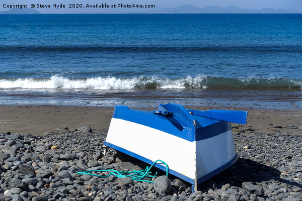 A small  boat on a beach  Picture Board by Steve Hyde