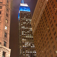 Buy canvas prints of The Empire State Building, New York City illuminated at night by Steve Hyde