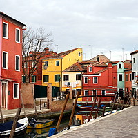 Buy canvas prints of The pretty cottages on Burano island. by Paul Clifton