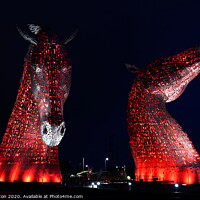 Buy canvas prints of The Kelpies in red. by Paul Clifton