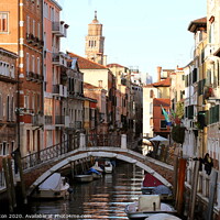 Buy canvas prints of Beautiful canal scene in Venice by Paul Clifton