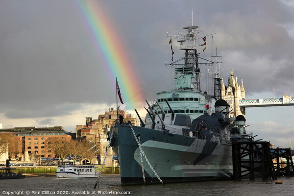 HMS Belfast fires a rainbow. Picture Board by Paul Clifton