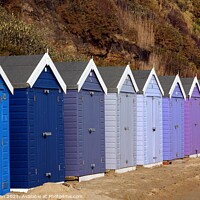 Buy canvas prints of Bournemouth beach huts in harmony. by Paul Clifton
