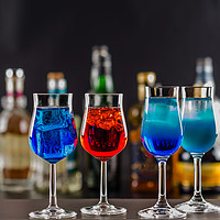 Buy canvas prints of Colorful drink on the background of bottles in ori by Q77 photo