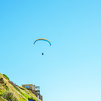 Buy canvas prints of Paraglider flying in the sky, free time spent acti by Q77 photo