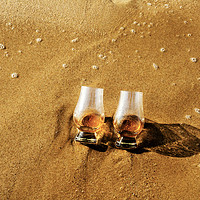 Buy canvas prints of a glass of whiskey single malt on the sand washed  by Q77 photo