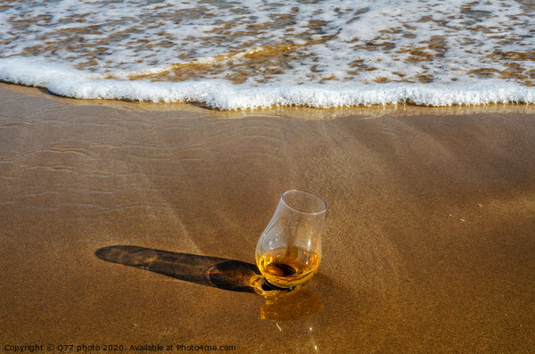a glass of whiskey single malt on the sand washed by the waves, a glass of tasting, relax on the beach Picture Board by Q77 photo