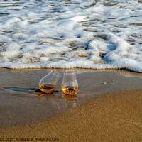 Buy canvas prints of two glasses of whiskey single malt on the sand washed by the waves, a glass of tasting, relax on the beach by Q77 photo