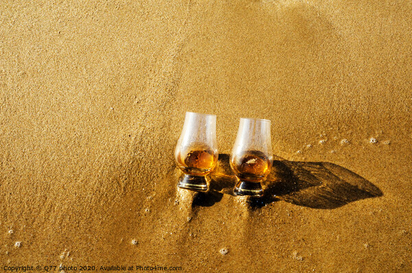 two glasses of whiskey single malt on the sand washed by the waves, a glass of tasting, relax on the beach Picture Board by Q77 photo