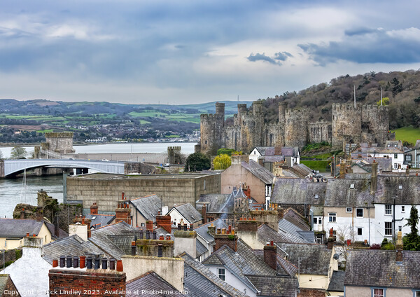 Conwy Castle Over The Rooftops Picture Board by Rick Lindley