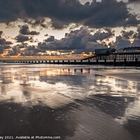 Buy canvas prints of Sunrise Reflections on Cromer Beach North Norfolk  by David Powley