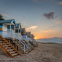Buy canvas prints of Beach Hut Sunset at Wells North Norfolk by David Powley