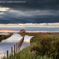 Buy canvas prints of Sunset Reflections in Flooded Thornham Harbour by David Powley