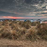 Buy canvas prints of Beach Hut Sunrise on Southwold Beach by David Powley