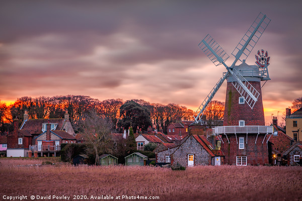 Winter sunrise at Cley Mill Norfolk Picture Board by David Powley