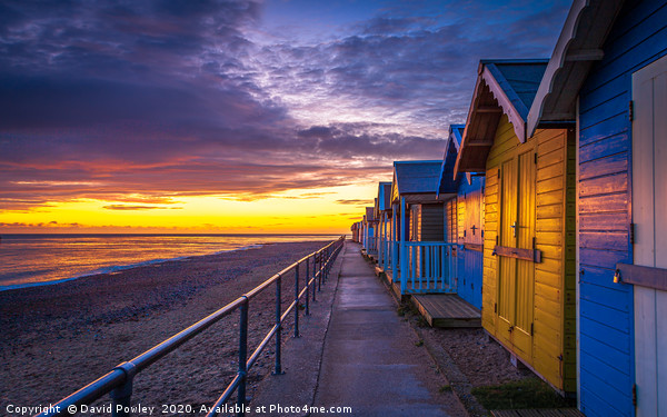 Sunrise over Cromer Beach Huts Framed Mounted Print by David Powley