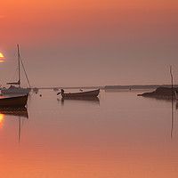 Buy canvas prints of Rising sun at Brancaster Staithe by David Powley