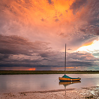 Buy canvas prints of Stormy sunset at Blakeney Harbour by David Powley