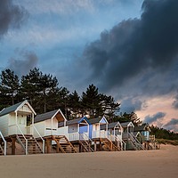 Buy canvas prints of Wells-next-the-sea Beach Huts at Sunset by David Powley