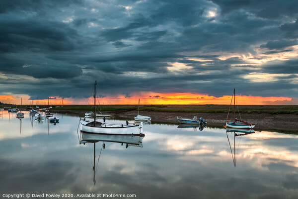 Stormy sunset over Burnham Overy Staithe Picture Board by David Powley