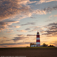 Buy canvas prints of Sunset clouds over Happisburgh Lighthouse by David Powley