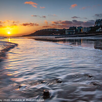 Buy canvas prints of Sunrise over Cromer beach Norfolk by David Powley