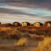 Buy canvas prints of Walberswick Beach Huts At Dawn by David Powley