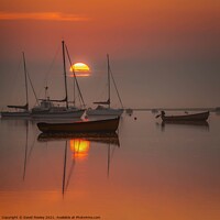 Buy canvas prints of Rising sun at Brancaster Staithe Norfolk by David Powley