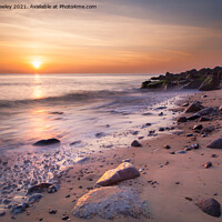 Buy canvas prints of Sunrise Glow on Sheringham Beach Norfolk by David Powley