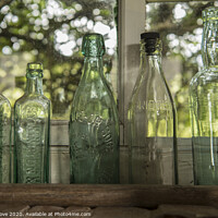 Buy canvas prints of seven green bottles standing in a row by Phillip Dove LRPS