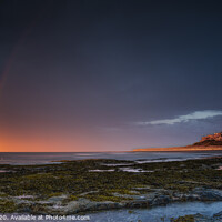 Buy canvas prints of Rainbows at Bamburgh Castle by Phillip Dove LRPS