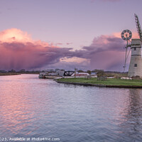 Buy canvas prints of Thurne Windmill and storm clouds  by Eddie Deane