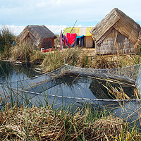 Buy canvas prints of Traditional huts on Uros floating islands by Theo Spanellis
