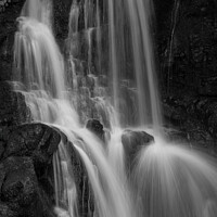 Buy canvas prints of Black rocks and white veil by Clive Ingram