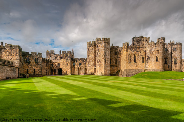Majestic Alnwick Castle on a Moody Autumn Day Picture Board by Clive Ingram