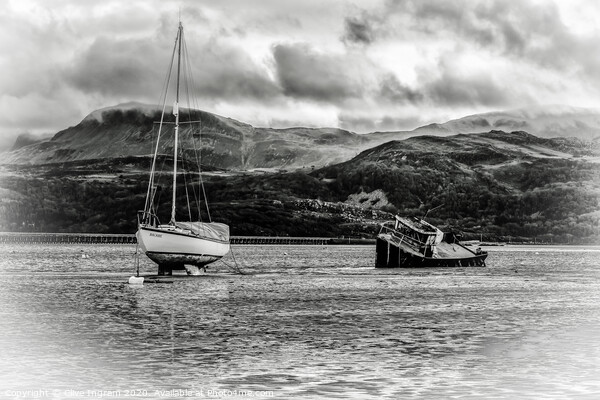Boats at low tide with mountain backdrop Picture Board by Clive Ingram