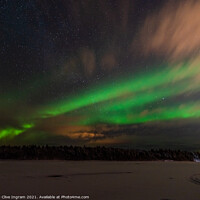 Buy canvas prints of Aurora on a Finnish riverbank by Clive Ingram