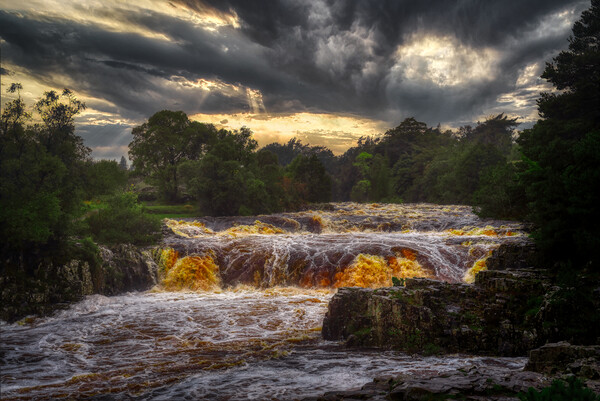 Low force waterfall during a storm Picture Board by simon cowan