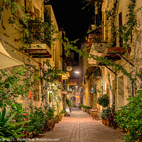 Buy canvas prints of an illuminated alley with green plants and balconies on the side by Stig Alenäs