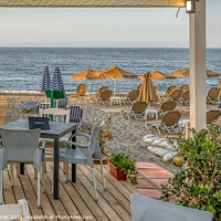Buy canvas prints of a Crete tavern on the beach with a view of the azure Mediterrane by Stig Alenäs