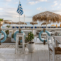 Buy canvas prints of greek restaurant with blue and white tables right on the beach w by Stig Alenäs