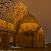 Buy canvas prints of The illuminated Roskilde Cathedral a misty night  by Stig Alenäs