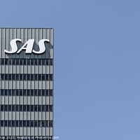 Buy canvas prints of SAS Radisson hotel and logo in Copenhagen against the blue sky by Stig Alenäs