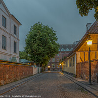 Buy canvas prints of The old town of Lund in the blue hour and and picturesque illumi by Stig Alenäs