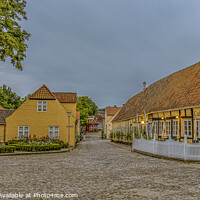 Buy canvas prints of Panoramic wiev of a cobbelstone square and the old timber framed by Stig Alenäs