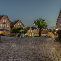 Buy canvas prints of the illuminated square in the small Danish town of Mariager duri by Stig Alenäs