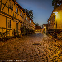 Buy canvas prints of streetlamp at twilight hour in the old cobbled street by Stig Alenäs