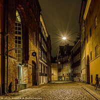 Buy canvas prints of street lamp hanging over an alley at night in Copenhagen by Stig Alenäs