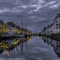Buy canvas prints of Christmas decorations in Nyhavn are reflected in the water durin by Stig Alenäs